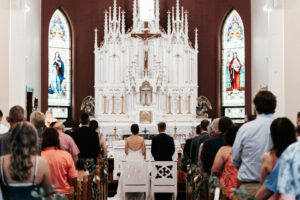 Catholic wedding ceremony during prayer