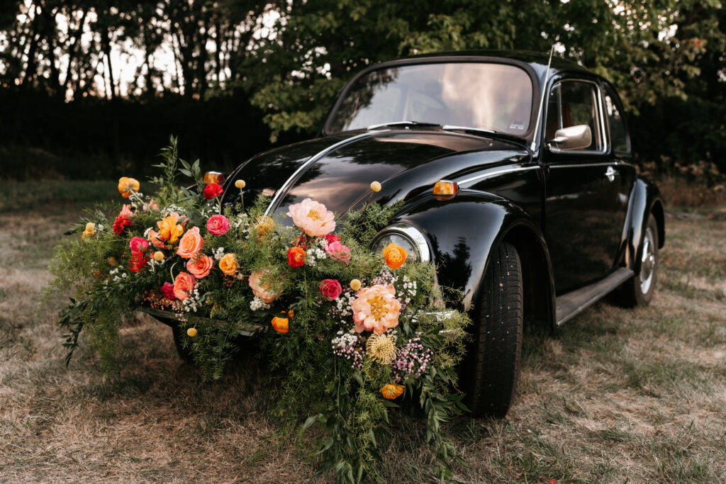 Vintage Volkswagen Bug styled with bright florals